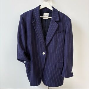 SANDRO Paris women’s blazer in classic navy blue with fine pinstripes.